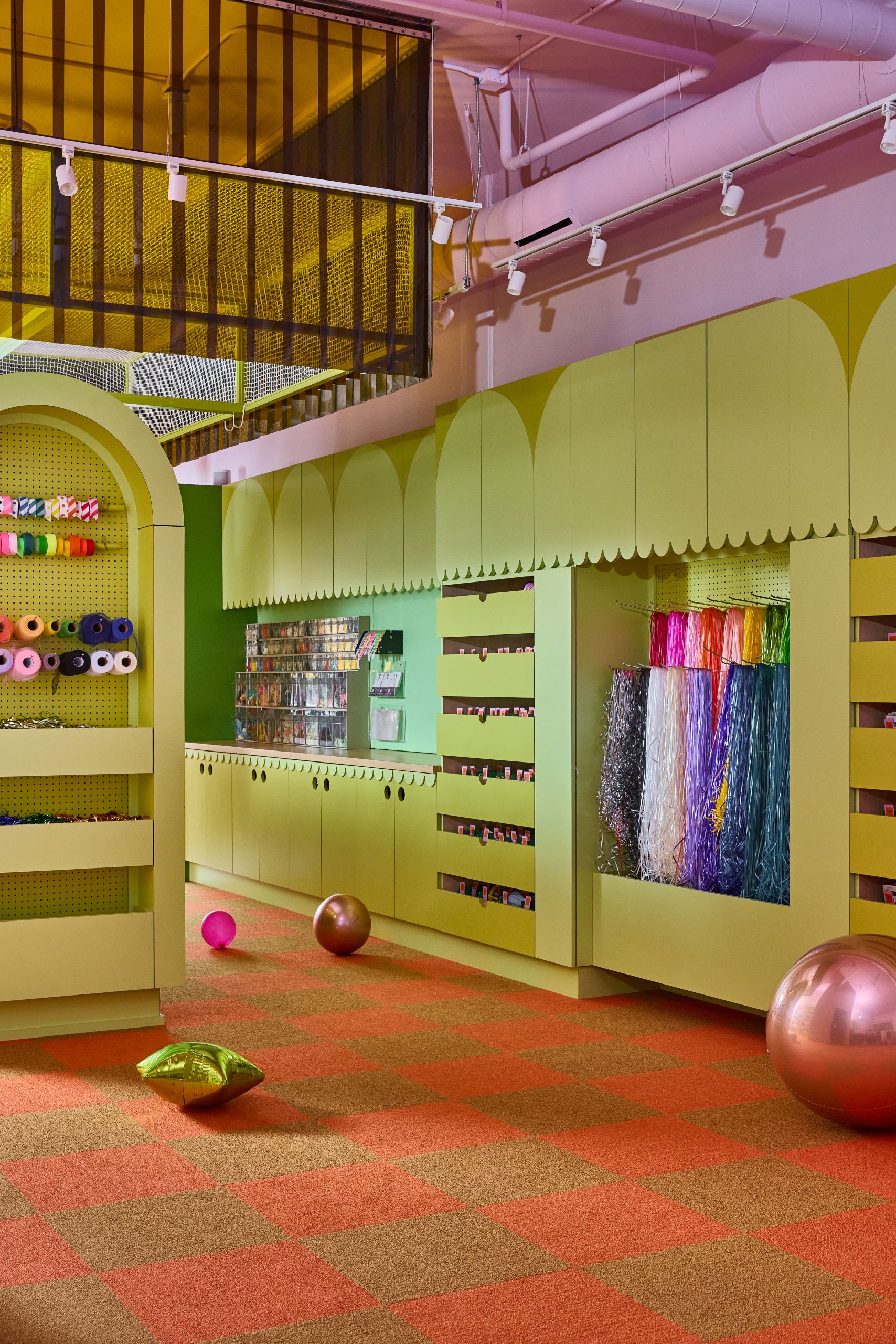 LUFT BALLOONS Chicago flagship interior featuring Abet Laminati Print HPL decorative laminates in 1850, 441, and 1823 Sei Finish, view of store fixtures.